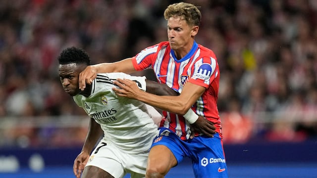 Vinicius Jr y Marcos Llorente en el Derbi de Madrid.