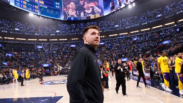 Los Angeles Lakers guard Luka Doncic stands along the baseline before an NBA basketball game against the Los Angeles Clippers, Tuesday, Feb. 4, 2025, in Inglewood, Calif. (AP Photo/Kevork Djansezian)