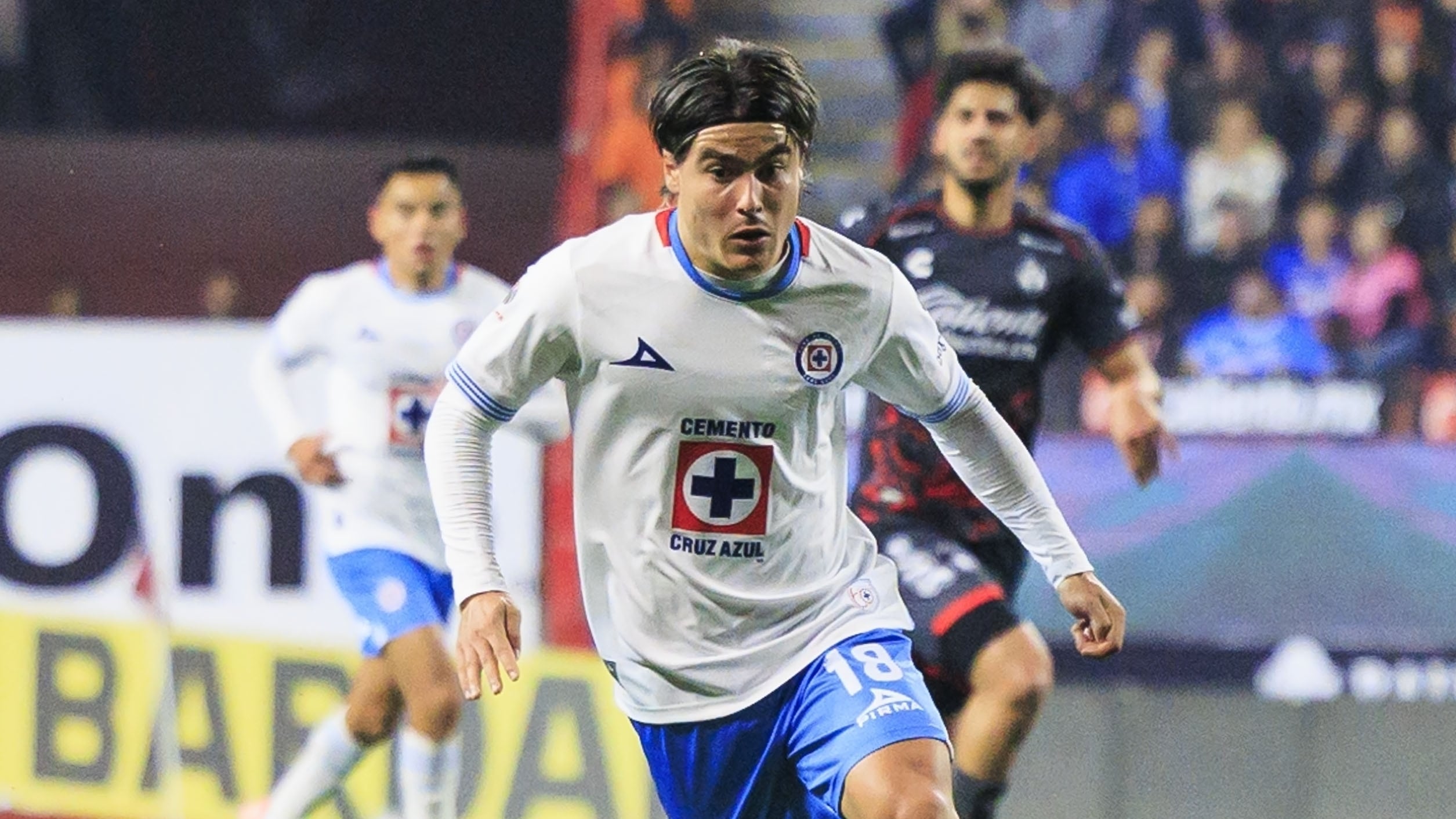 Luka Romero (L) of Cruz Azul fights for the ball with Efrain Alvarez (R) of Tijuana during the 4th round match between Tijuana and Cruz Azul as part of the Liga BBVA MX, Torneo Clausura 2025 at Caliente Stadium, on January 31, 2025 in Tijuana, Baja California, Mexico.